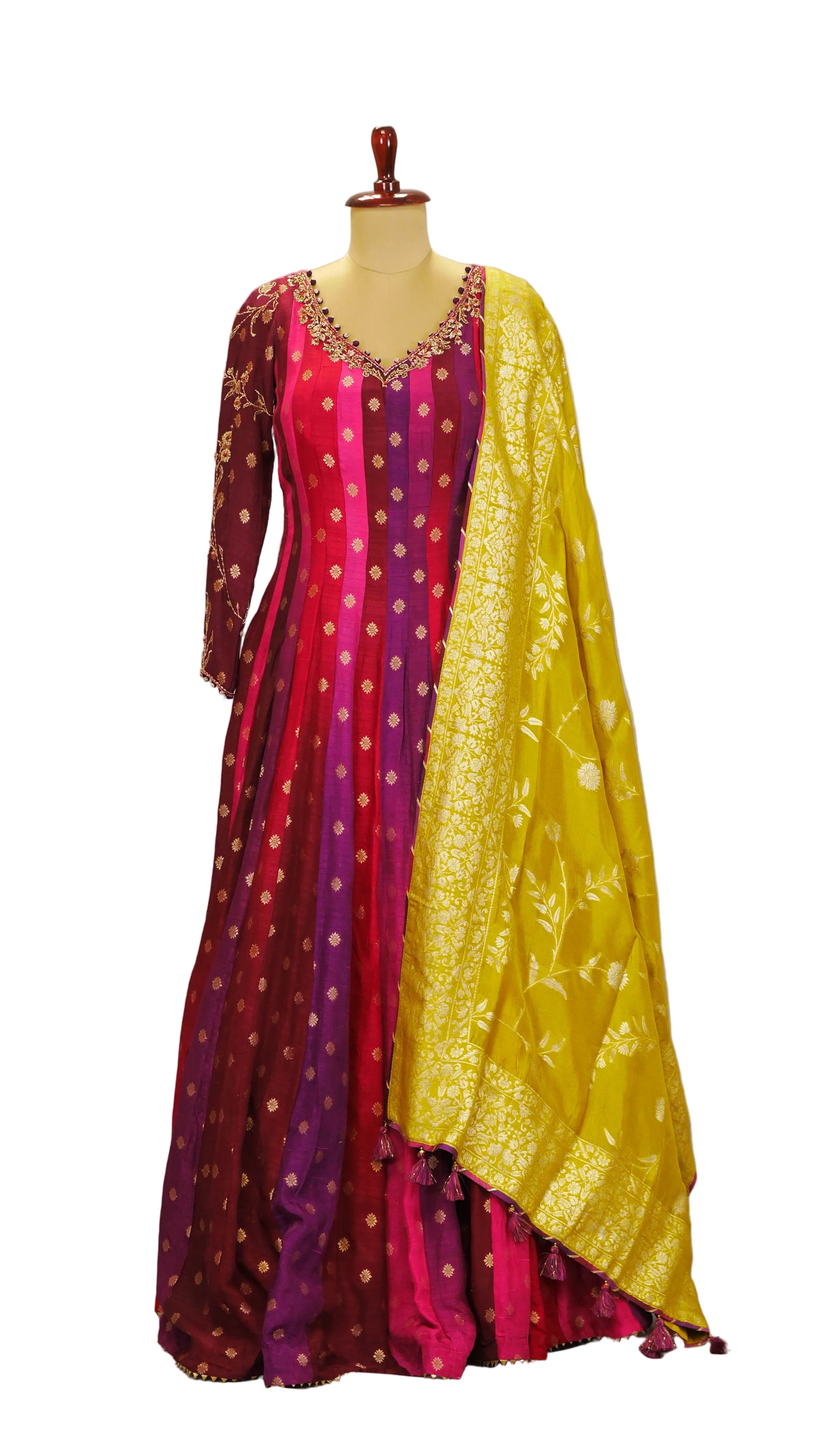 Traditional Anarkali outfit with pink and yellow dress on a mannequin against a plain background