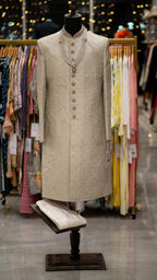 Traditional sherwani on a mannequin in a clothing store setting