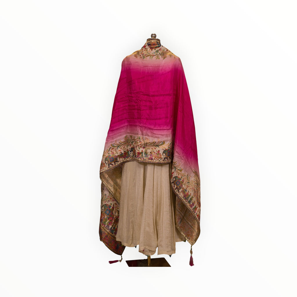Zari Designs Anarkali dress featuring a cream skirt and a vibrant pink ombre dupatta with intricate folk art borders