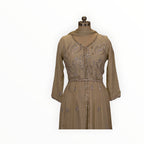 Zari Designs beige Anarkali dress featuring intricate silver sequin embroidery and a delicate pleated skirt