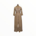 Zari Designs beige Anarkali dress with intricate silver embroidery and a front slit on a mannequin