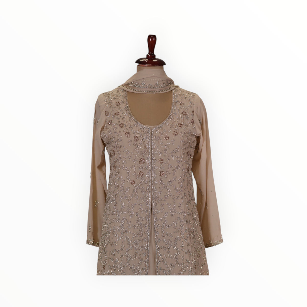 Zari Designs beige georgette Anarkali gown featuring intricate silver embroidery and a classic scoop neckline.
