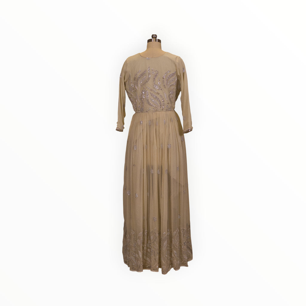 Zari Designs beige Anarkali dress with silver sequin embroidery on a mannequin in a boutique setting