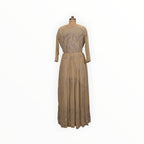Zari Designs beige Anarkali dress with silver sequin embroidery on a mannequin in a boutique setting