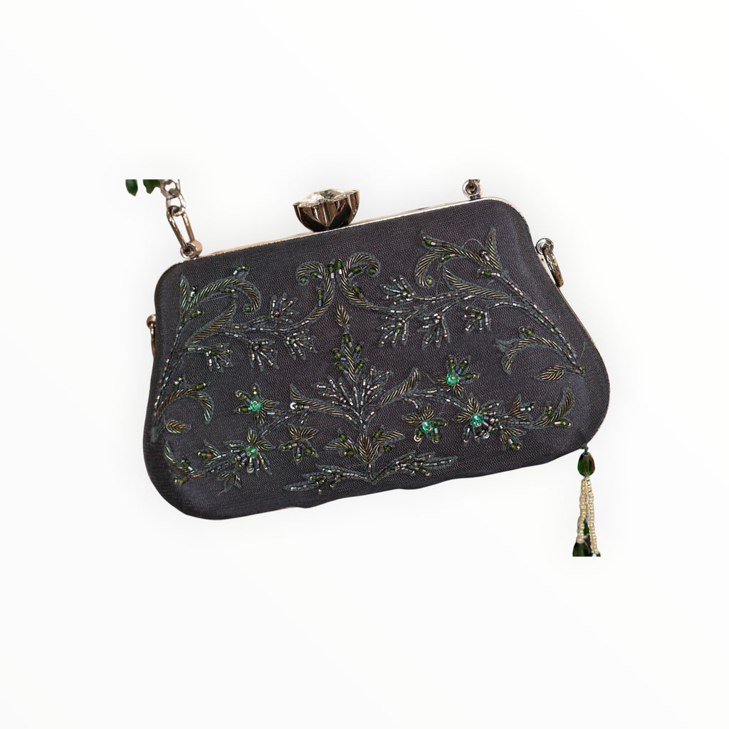 Zari Designs black clutch bag with intricate green beadwork and floral embroidery, featuring a crystal clasp.
