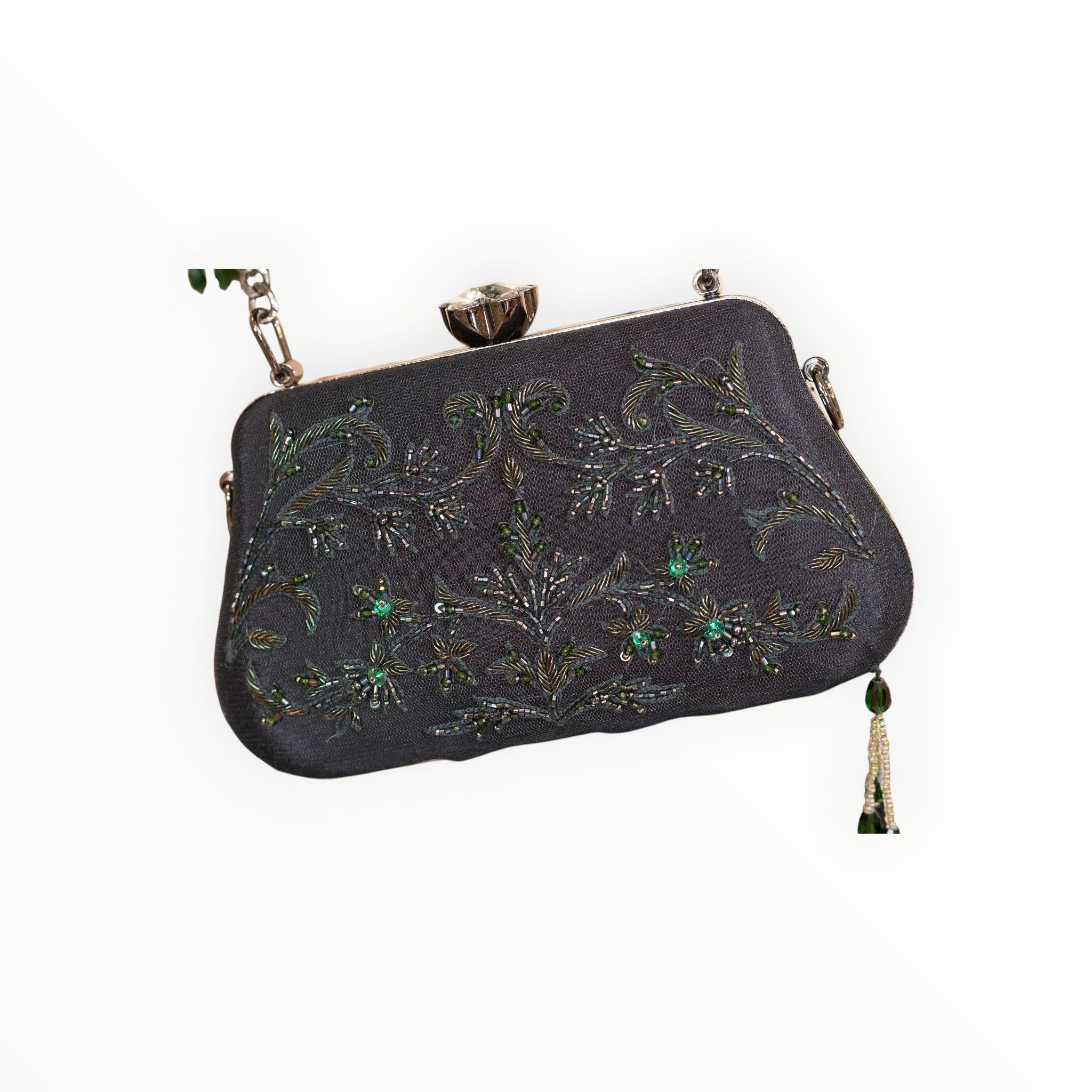 Zari Designs black clutch bag with intricate green beadwork and floral embroidery, featuring a crystal clasp.