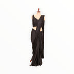 Zari Designs black ready-to-wear saree featuring a sleeveless sequined blouse with beaded hem detail on a mannequin.