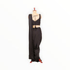 Zari Designs black ready-to-wear saree with a sleeveless blouse, featuring sequin border and back tie-up detail.