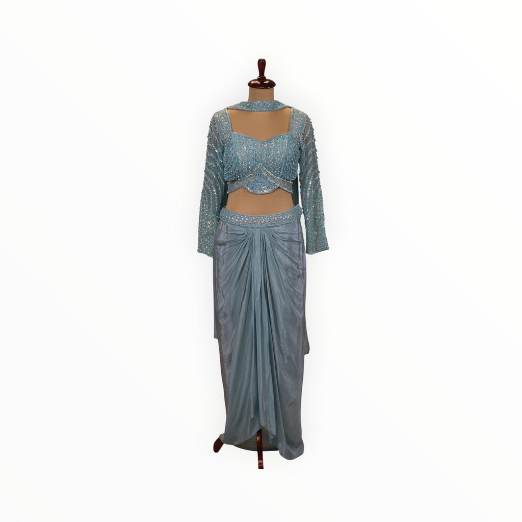 Zari Designs light blue Indo Western set featuring a sequin-embellished crop top and a draped dhoti-style skirt.