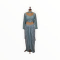 Zari Designs light blue Indo Western set featuring a sequin-embellished crop top and a draped dhoti-style skirt.