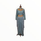 Zari Designs light blue Indo Western set featuring a sequin-embellished crop top and a draped dhoti-style skirt.