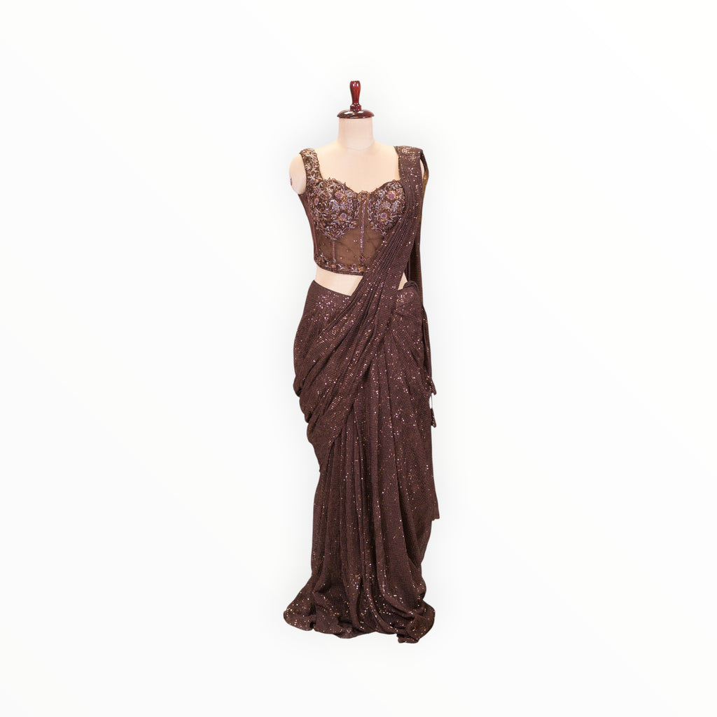 Zari Designs ready-to-wear brown sequined saree with a matching embellished corset-style blouse on a mannequin.