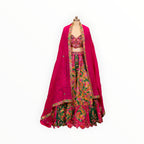 Zari Designs Carnival Lehnga featuring a vibrant green and pink floral embroidered skirt with a matching crop top