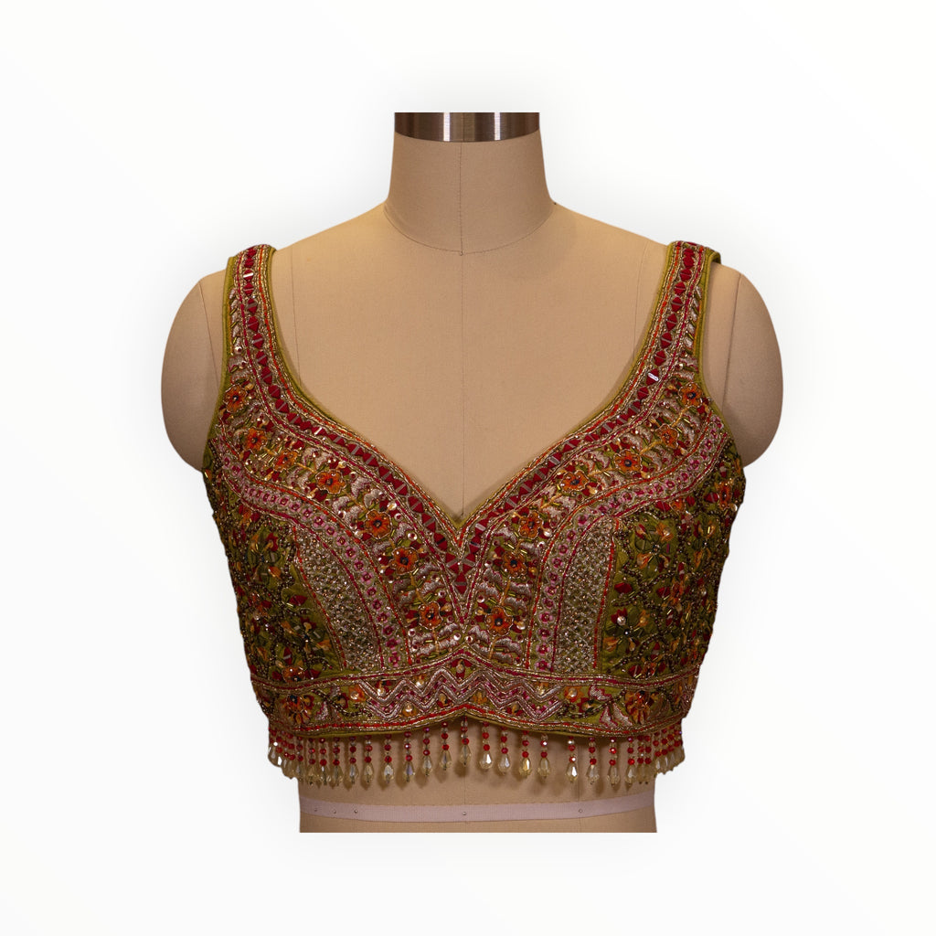Zari Designs Carnival Lehnga blouse featuring intricate multi-colored floral embroidery, beadwork, and pearl fringe.