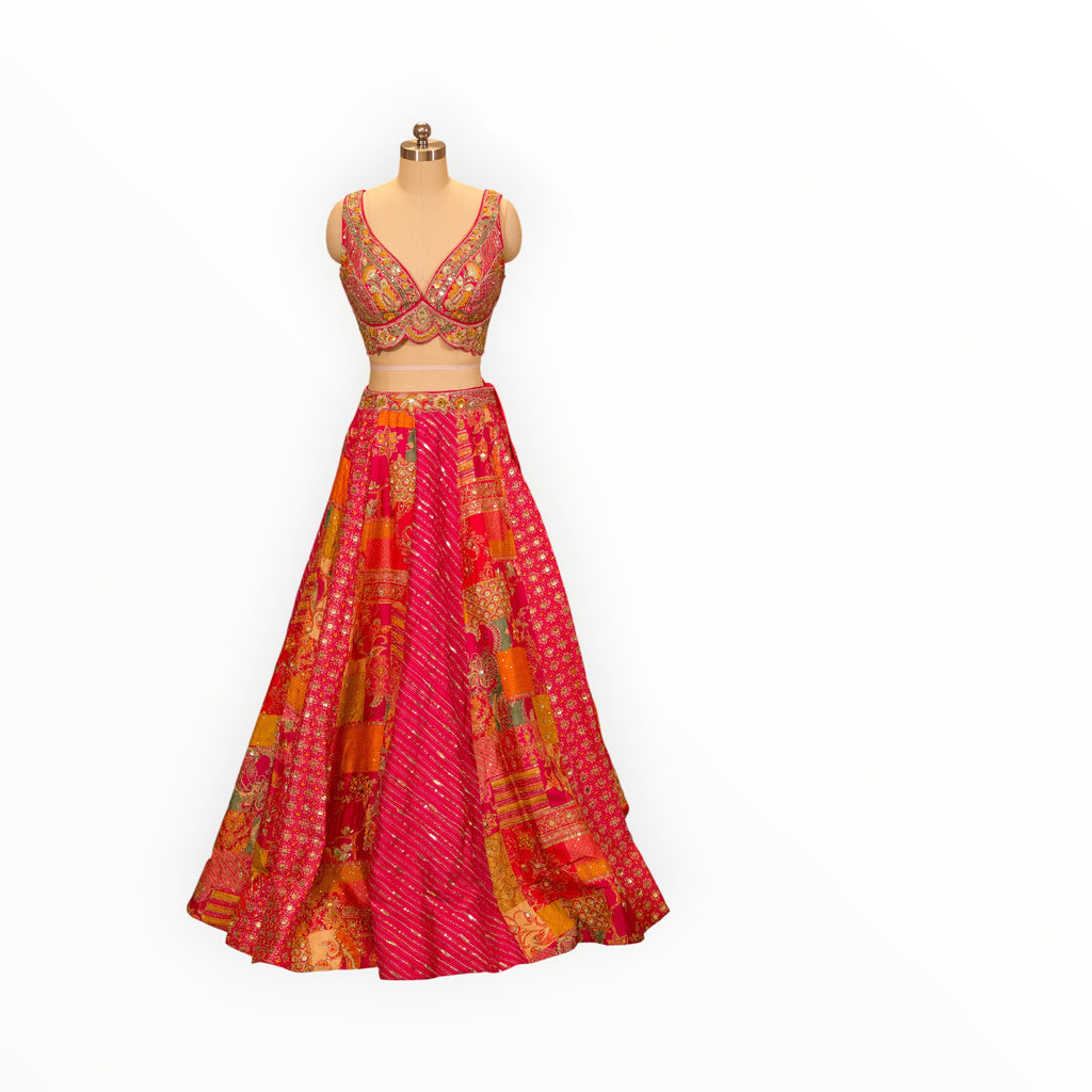Zari Designs Carnival Lehnga featuring a vibrant pink and orange patchwork skirt with intricate embroidery and mirror work