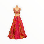 Zari Designs Carnival Lehnga featuring a vibrant pink and orange patchwork skirt with intricate embroidery and mirror work