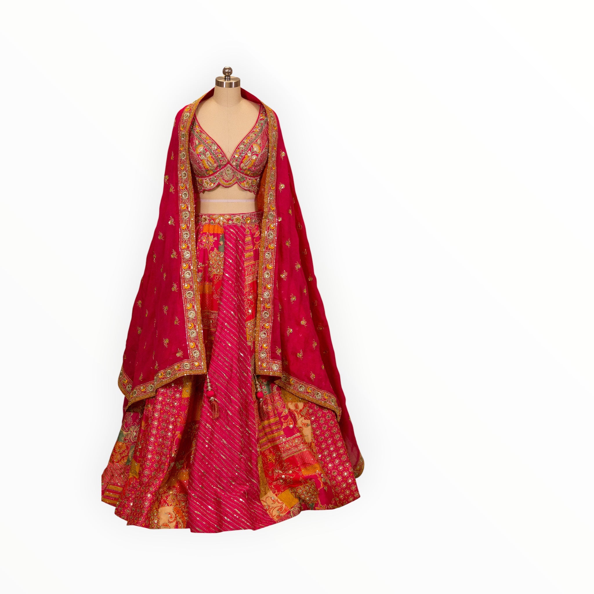 Zari Designs Carnival Lehnga featuring a vibrant pink and orange patchwork skirt with intricate gold embroidery