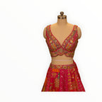 Zari Designs Carnival Lehnga featuring vibrant pink patchwork fabric with intricate gold embroidery and mirror work.