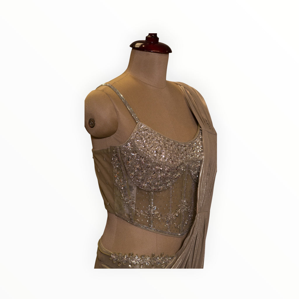 Zari Designs ready saree featuring a champagne corset-style blouse with intricate silver beadwork and sequins.