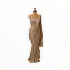 Zari Designs champagne gold ready-to-wear saree with a heavily embellished sequin corset blouse on a mannequin.