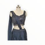 Zari Designs charcoal grey lehenga choli with intricate silver beadwork and sequin embroidery on a mannequin
