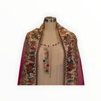 Zari Designs cream Anarkali dress featuring a vibrant carnival-themed dupatta with intricate elephant embroidery