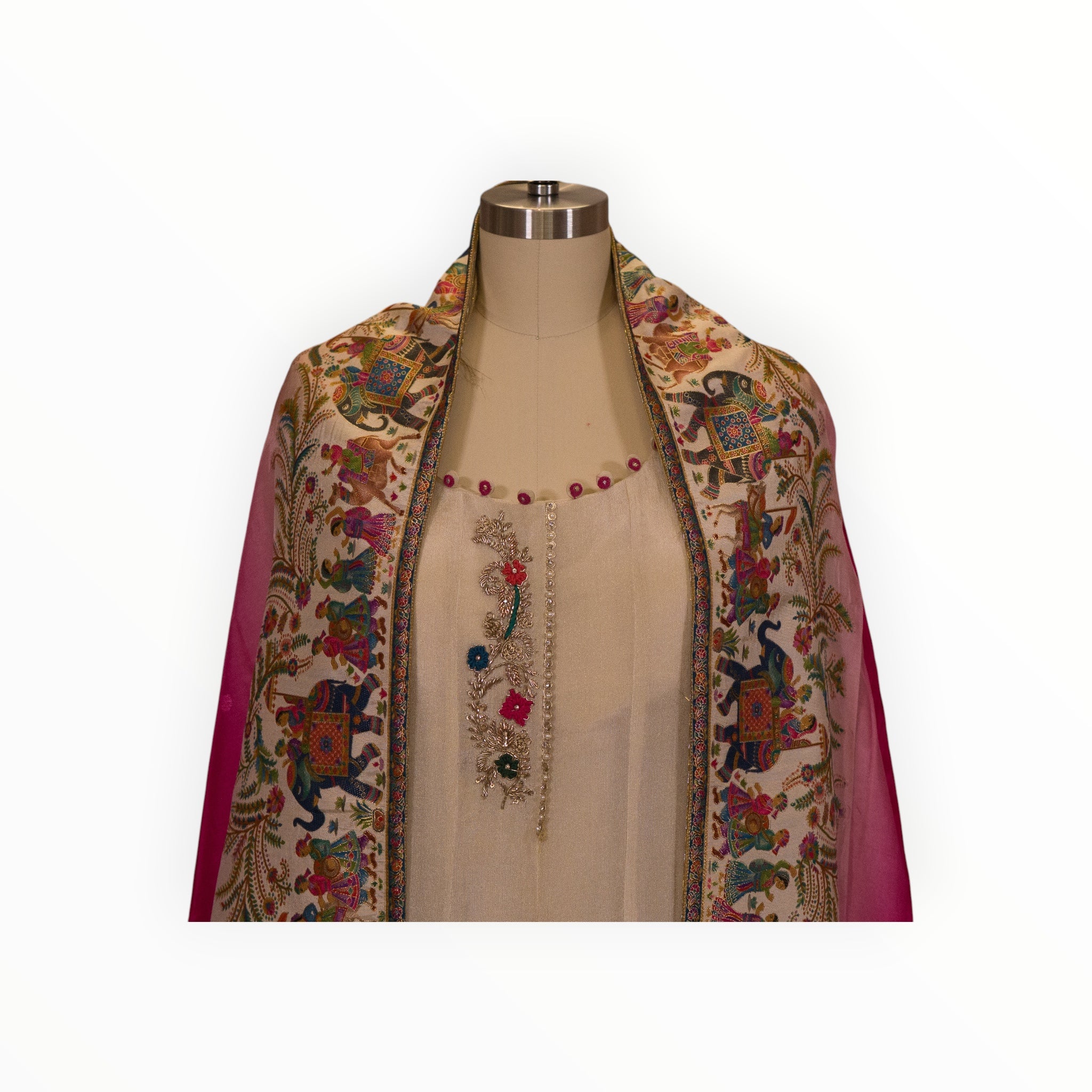 Zari Designs cream Anarkali dress featuring a vibrant carnival-themed dupatta with intricate elephant embroidery