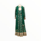 Zari Designs emerald green Anarkali dress with intricate gold geometric patterns, keyhole back, and matching dupatta.