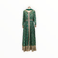 Zari Designs emerald green Anarkali dress with gold bandhani print, intricate embroidery, and matching dupatta