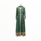 Zari Designs emerald green Anarkali dress with gold bandhani print, intricate embroidery, and matching dupatta