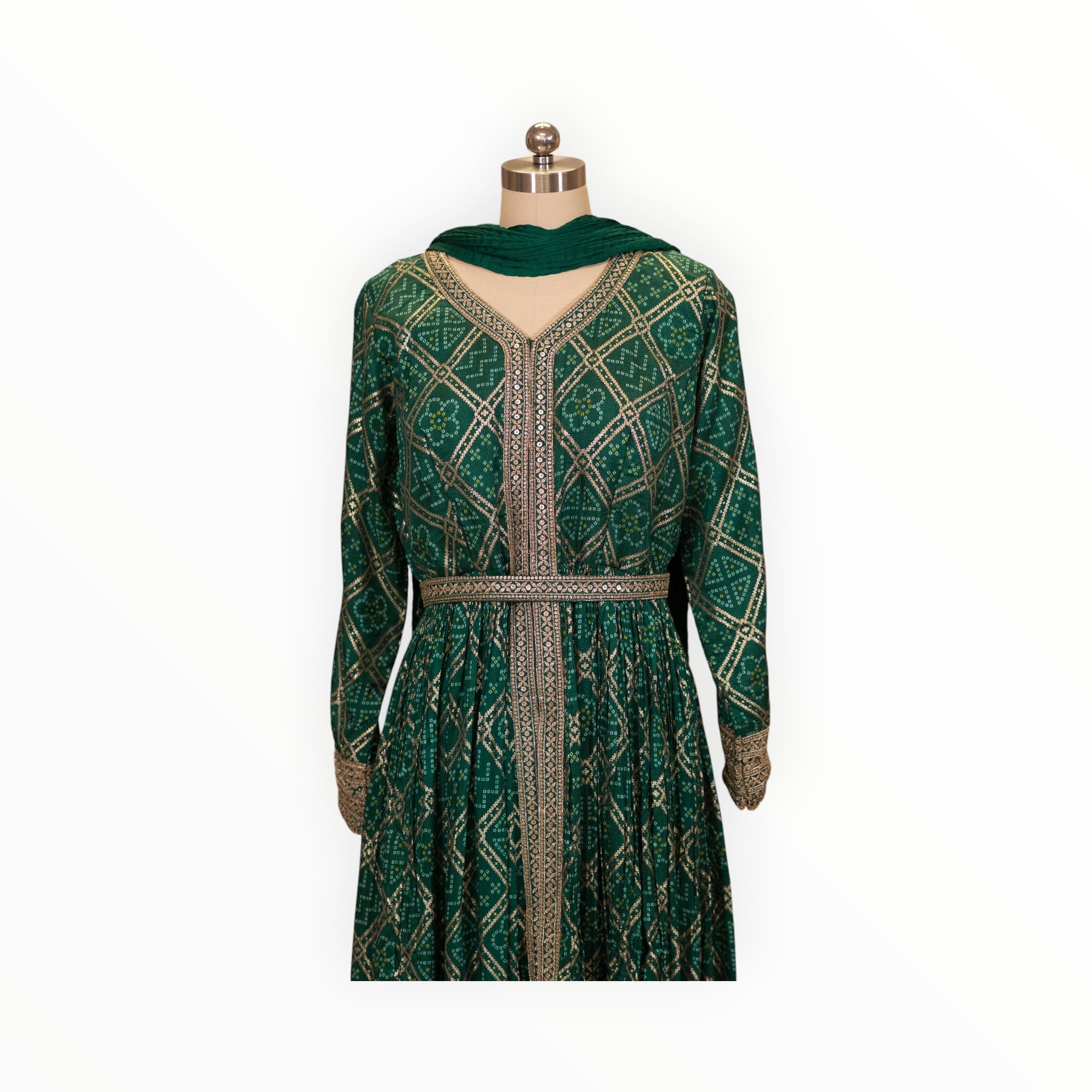 Zari Designs emerald green Anarkali dress with gold bandhani print, V-neck, and intricate embroidered waist belt.