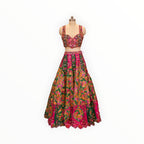 Zari Designs Carnival Lehnga featuring a vibrant pink and green floral embroidered crop top and matching flared skirt.