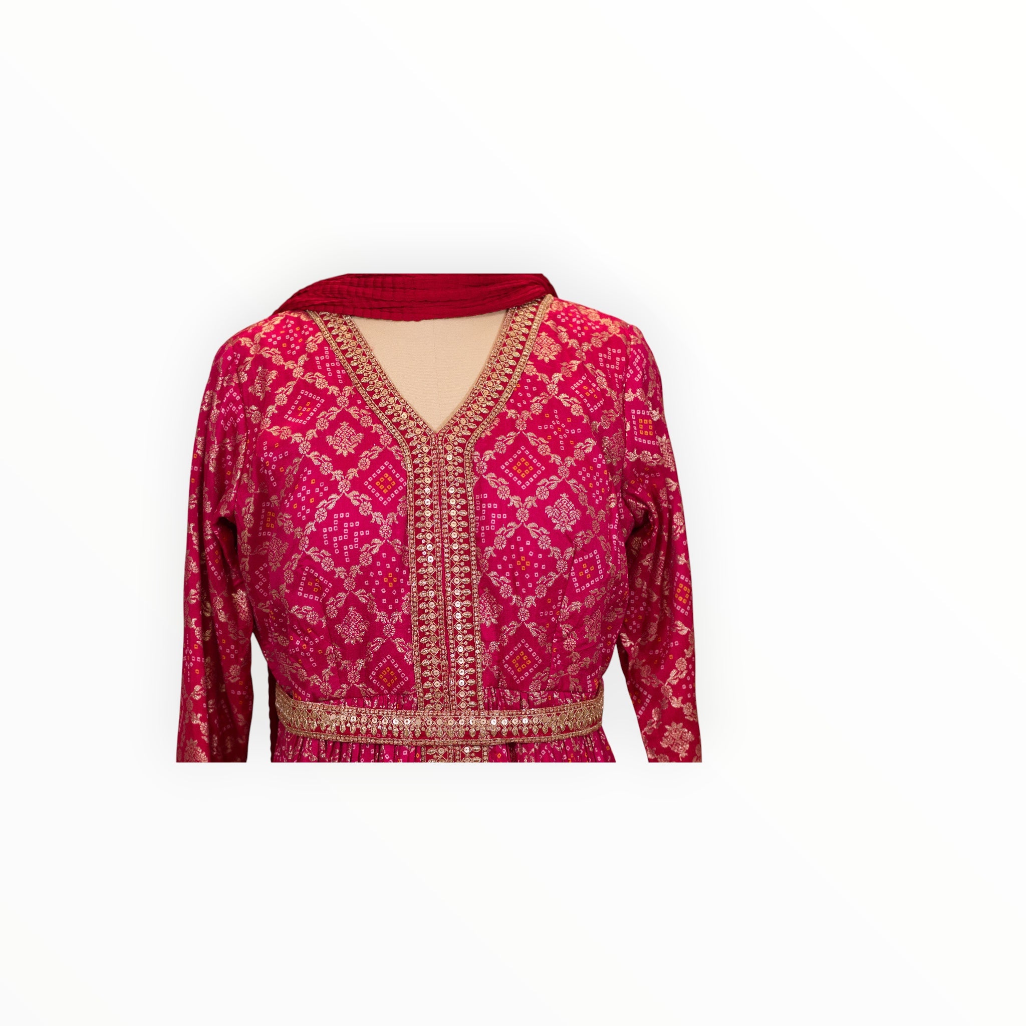Zari Designs fuchsia pink Anarkali dress with gold bandhani print, sequin embroidery, and a matching red dupatta.