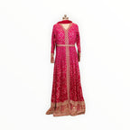 Zari Designs fuchsia pink Anarkali dress with intricate gold embroidery, bandhani print, and a matching dupatta.