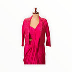 Zari Designs fuchsia pink Indo-Western saree gown featuring a draped skirt and a sequin-embellished cropped blazer.