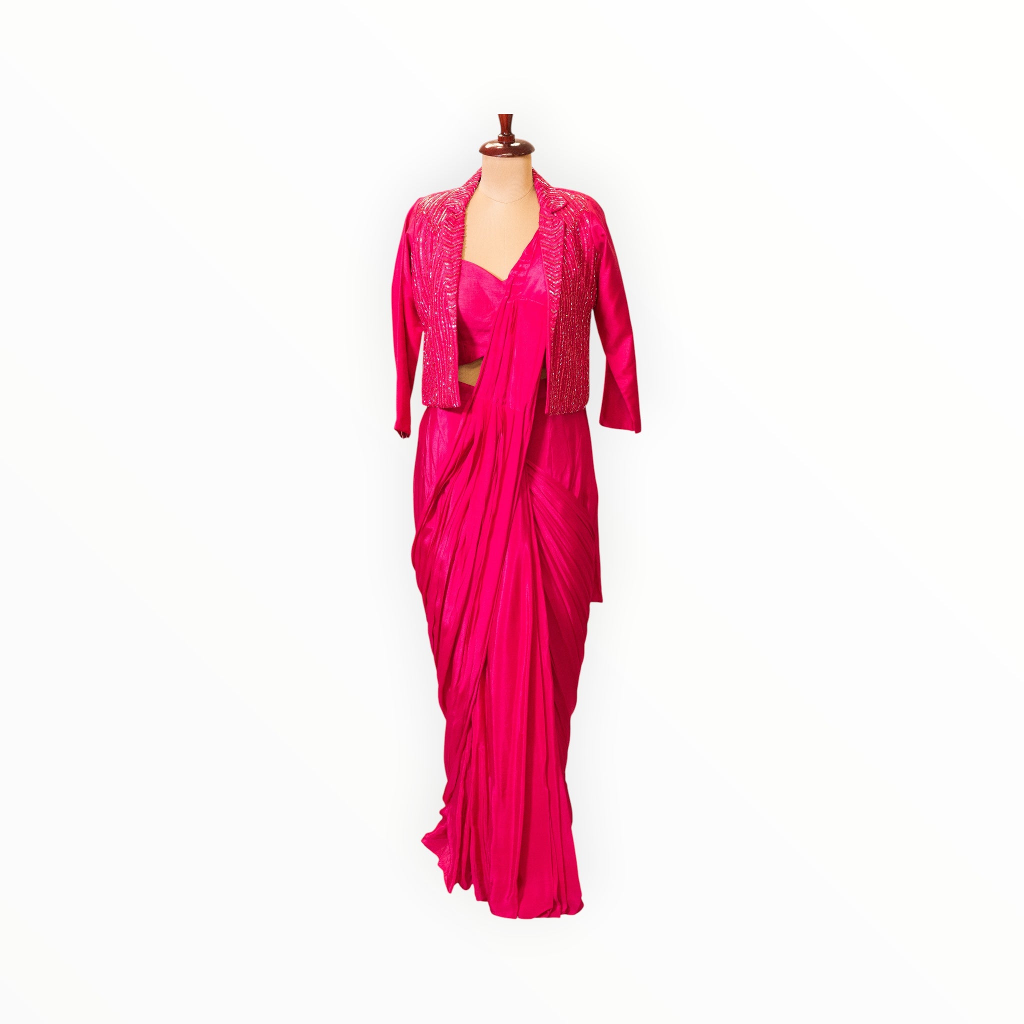 Zari Designs fuchsia pink Indo-Western saree with a matching embellished jacket on a mannequin