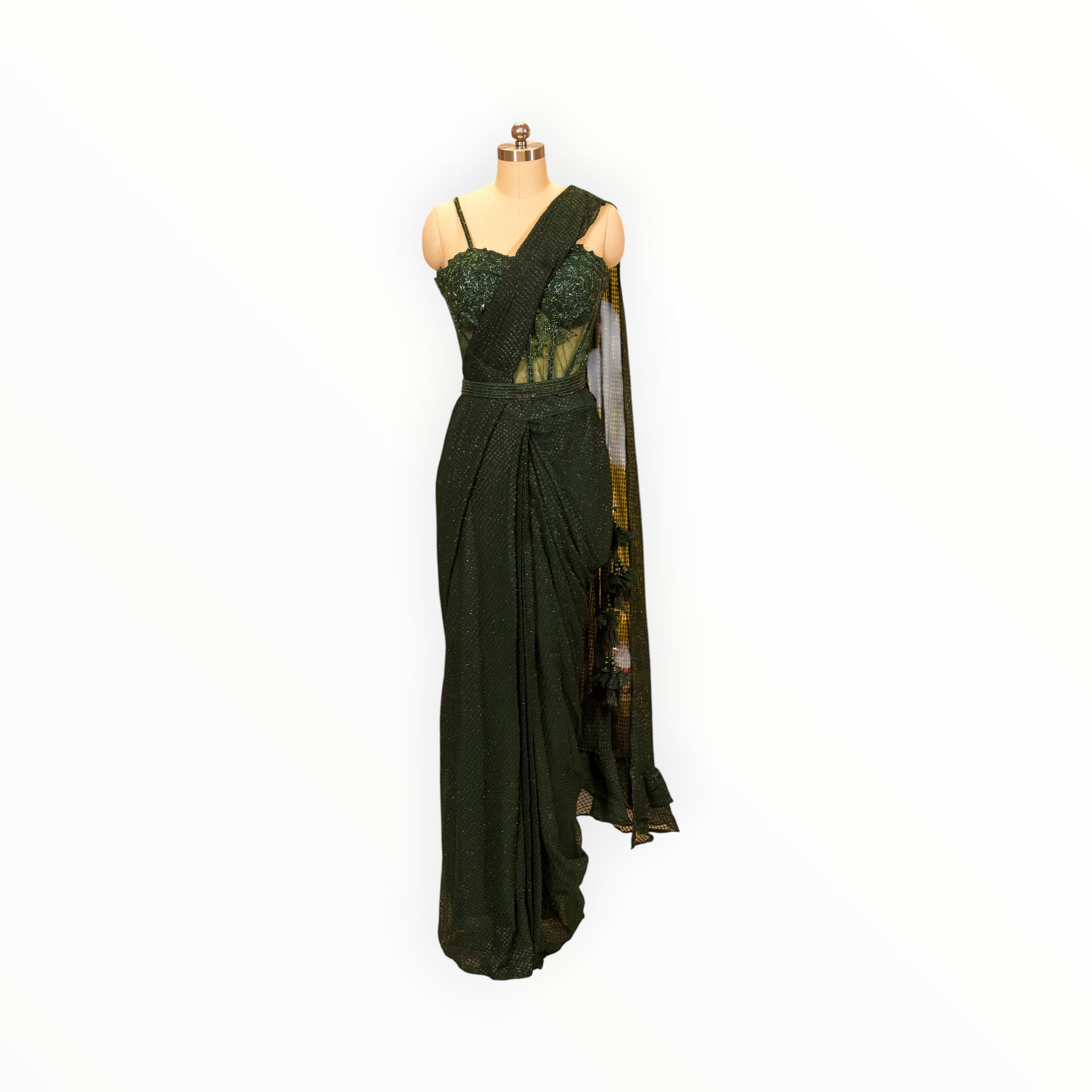 Zari Designs dark green pre-draped saree with an embellished corset blouse and matching waist belt on a mannequin.