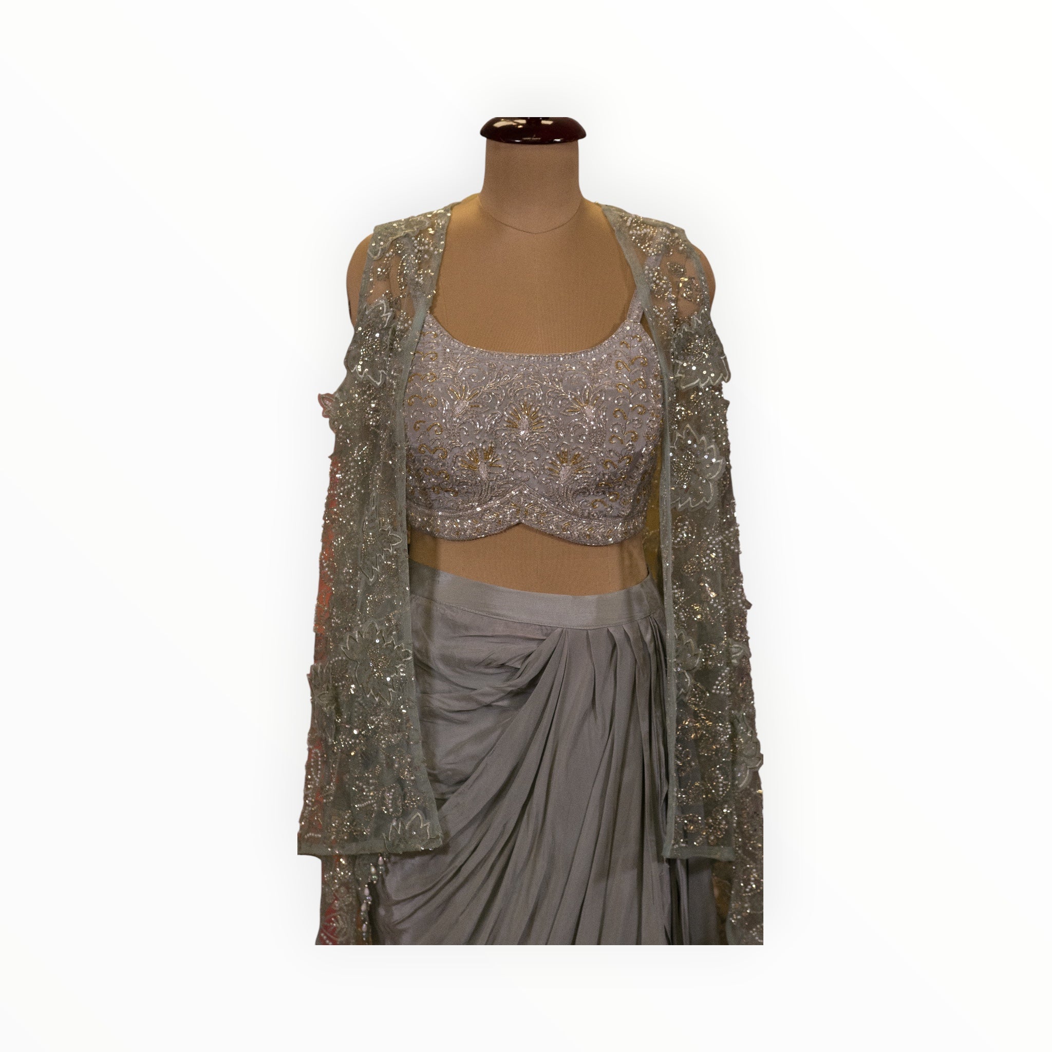 Zari Designs Indo Western crepe outfit featuring a grey draped skirt and a heavily embroidered silver sequin blouse