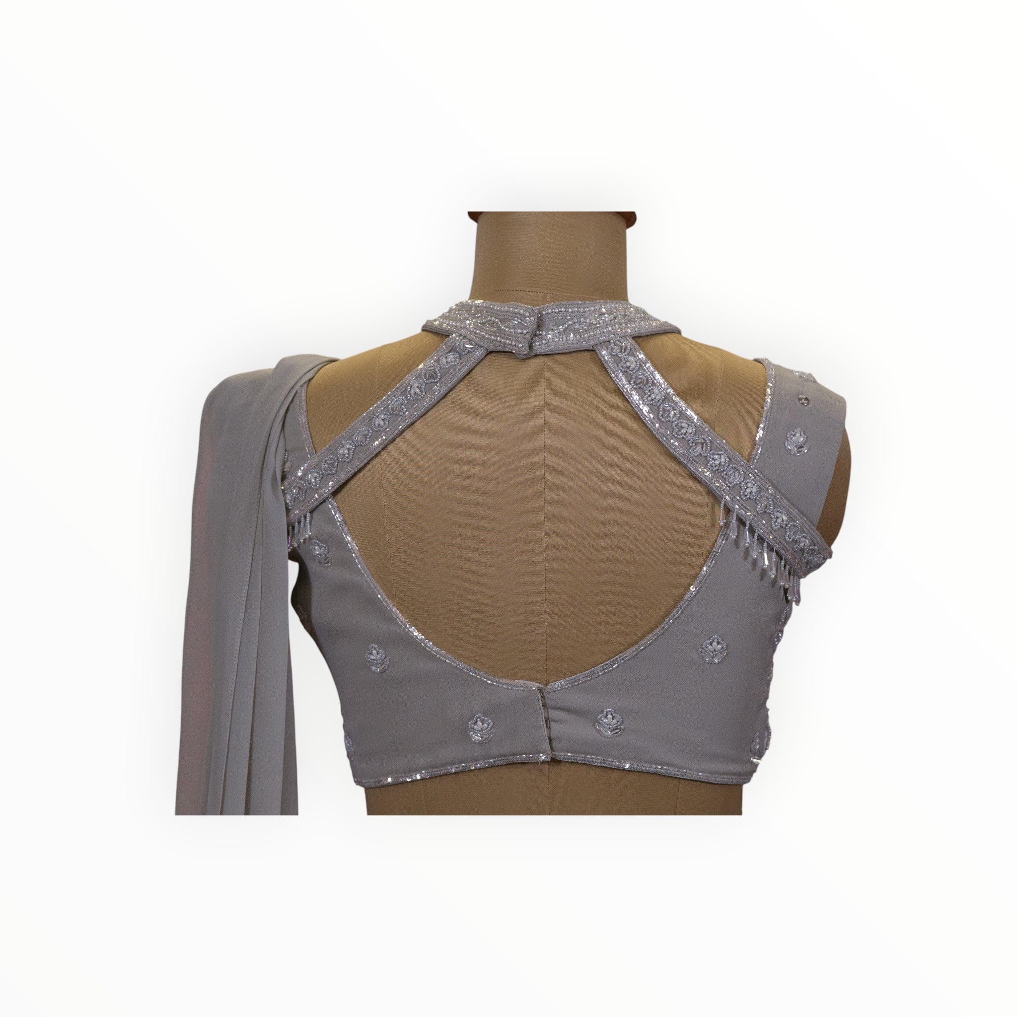 Zari Designs grey georgette ready drape saree blouse with intricate silver embroidery and a stylish cutout back