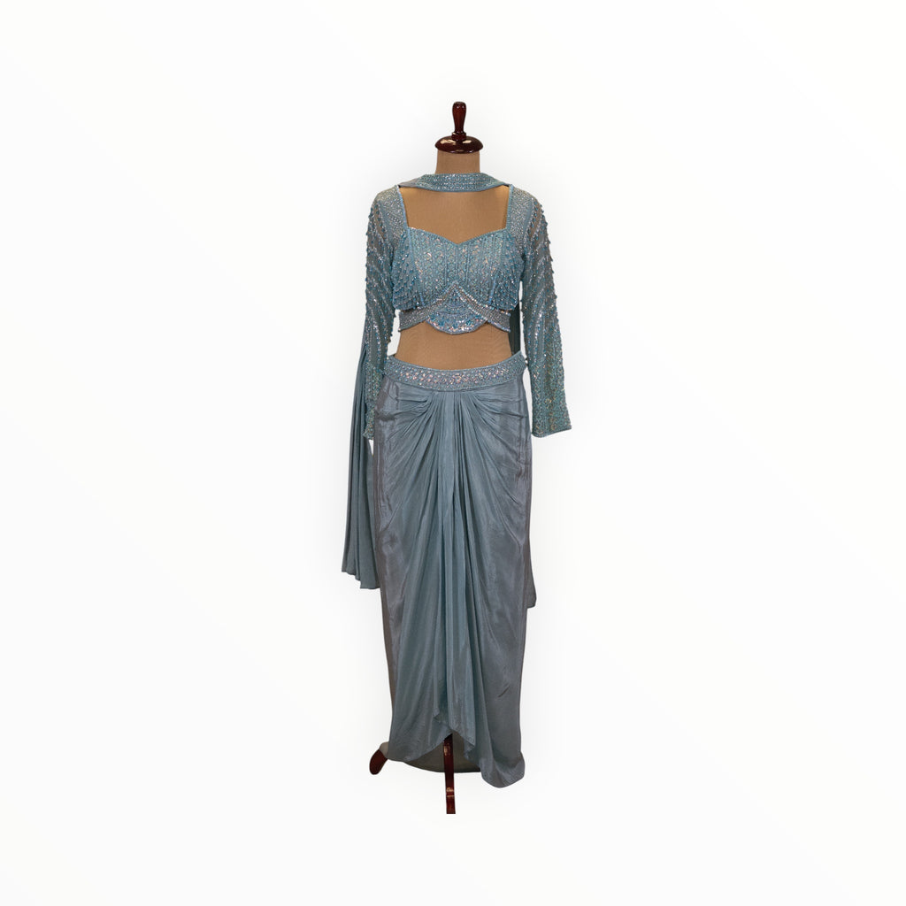 Zari Designs light blue Indo Western set with a sequined cropped blouse and a draped dhoti-style skirt on a mannequin