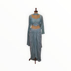 Zari Designs light blue Indo Western set with a sequined cropped blouse and a draped dhoti-style skirt on a mannequin