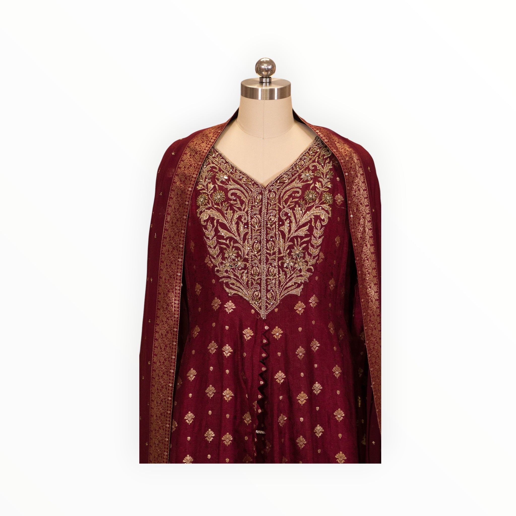 Zari Designs maroon Anarkali dress with intricate gold floral embroidery and matching dupatta on a mannequin
