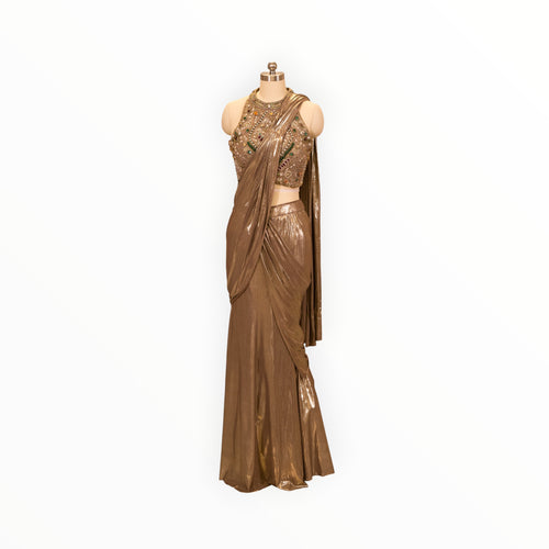 Zari Designs metallic bronze drape saree with a heavily embellished sleeveless blouse featuring intricate beadwork.
