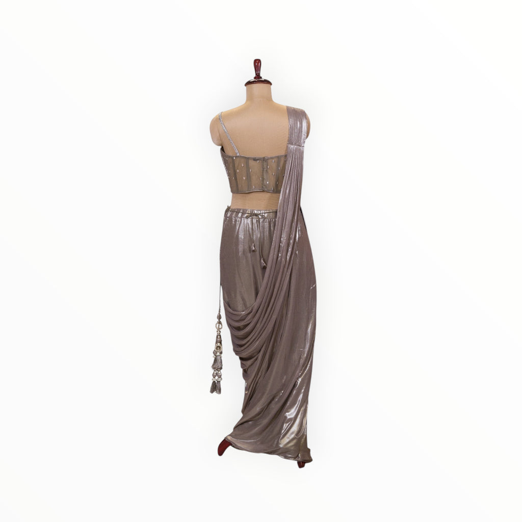Zari Designs metallic silver ready-to-wear saree with a sleeveless embellished blouse and draped skirt on a mannequin