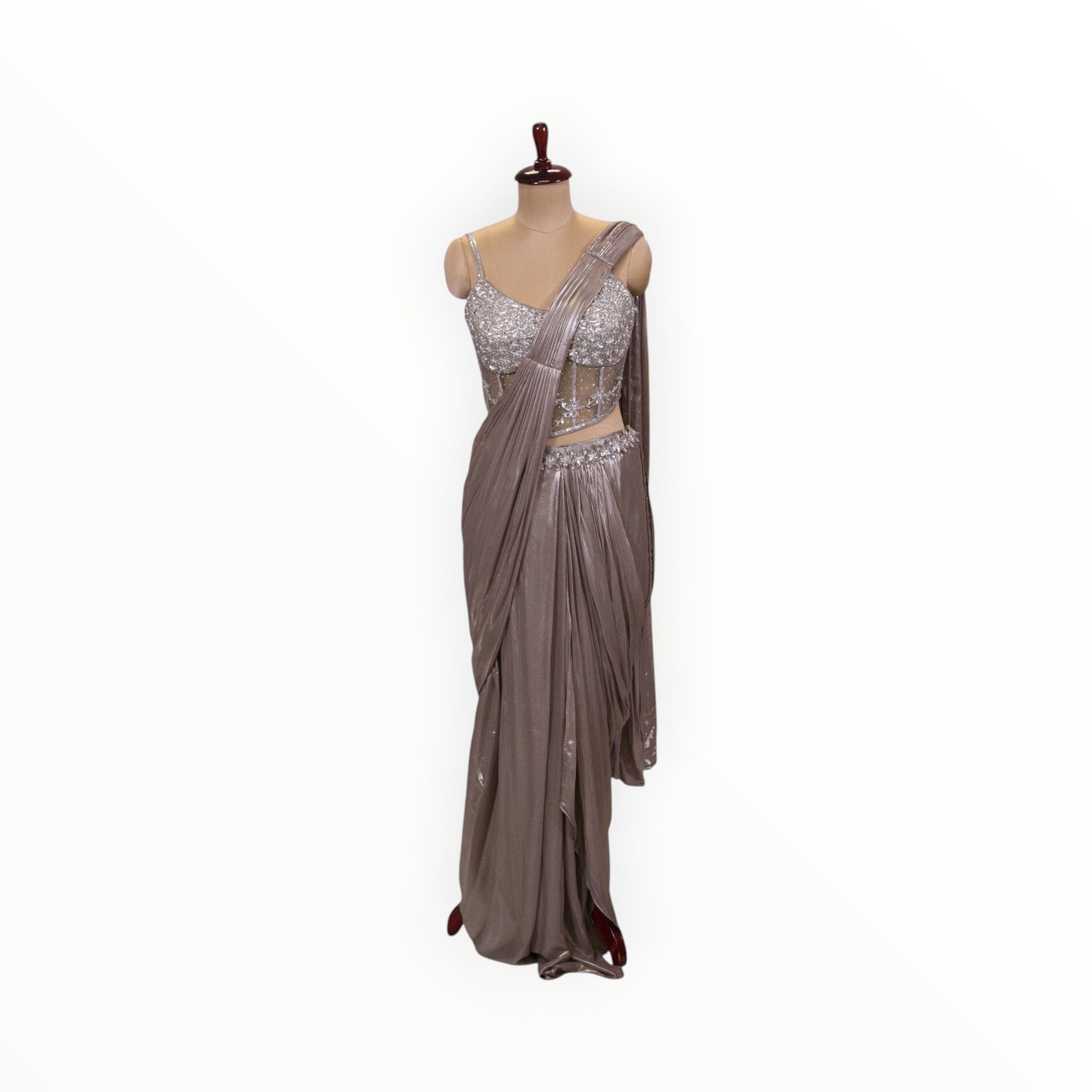 Zari Designs ready-to-wear metallic taupe saree with a heavily embellished silver sequin corset blouse on a mannequin.