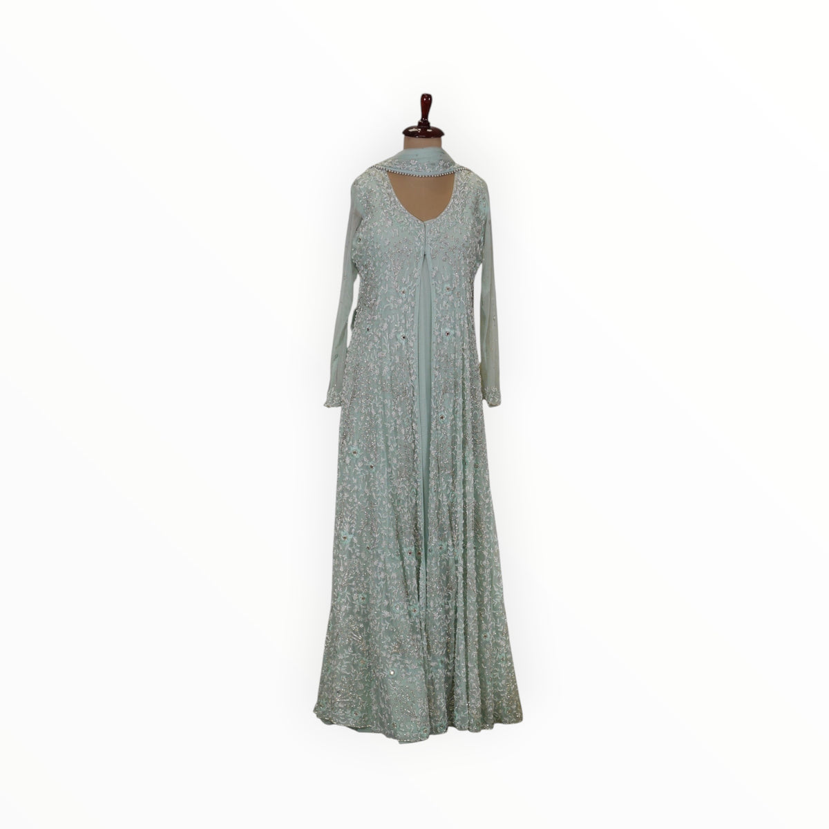 Zari Designs mint green Anarkali style gown with intricate silver embroidery and long sheer sleeves on a mannequin