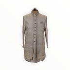 Zari Designs men's off-white Indo-Western sherwani with intricate embroidery, metallic buttons, and pocket square.