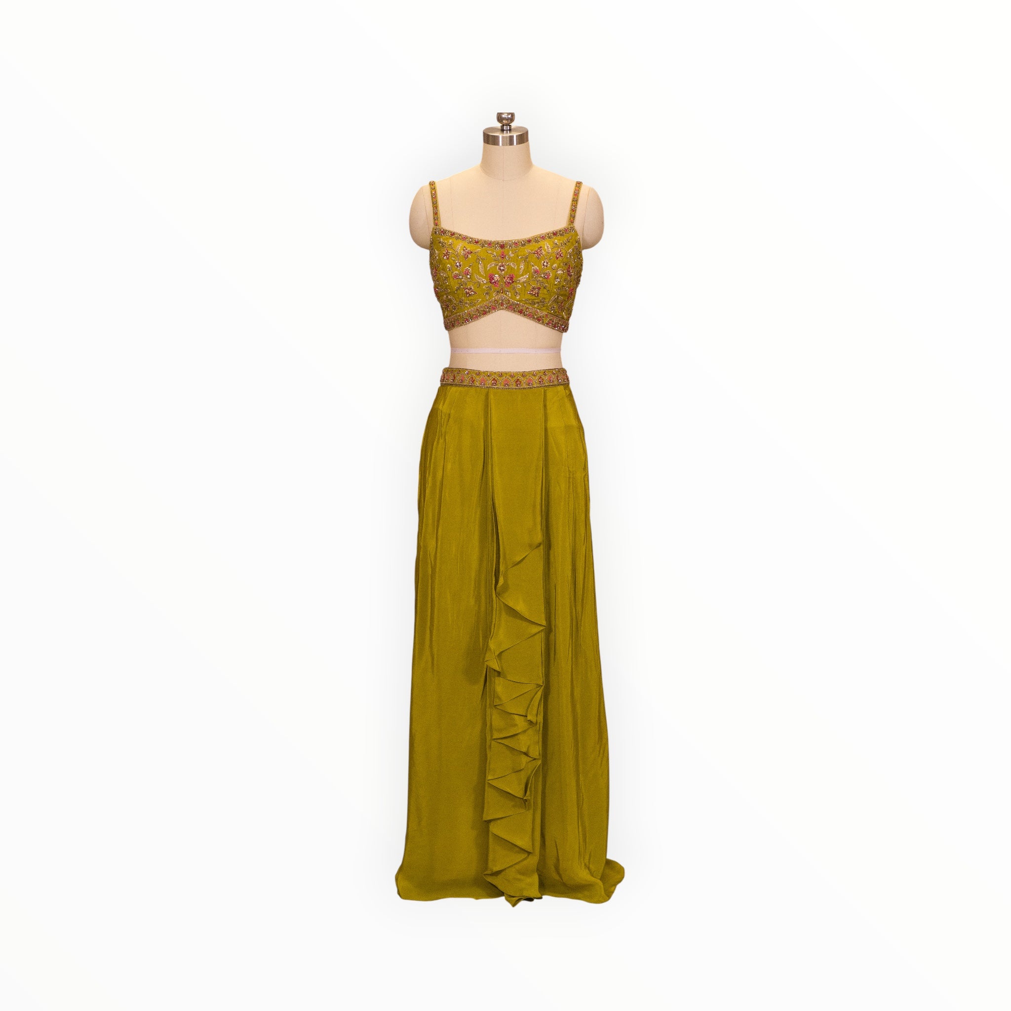 Zari Designs olive green drape saree with an embroidered sleeveless blouse and ruffled skirt on a mannequin