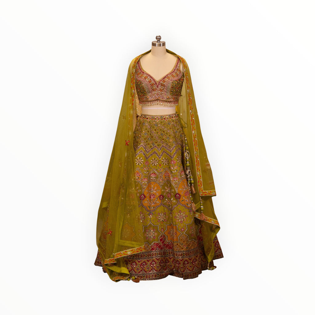 Zari Designs olive green carnival lehnga with intricate embroidery, sequin work, and a matching sheer dupatta on mannequin
