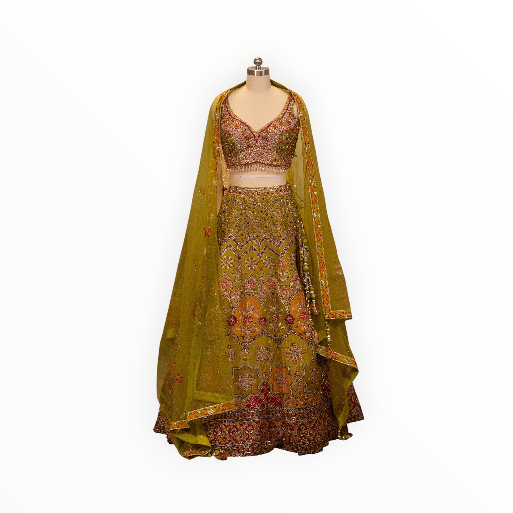Zari Designs olive green carnival lehnga with intricate embroidery, sequin work, and a matching sheer dupatta on mannequin